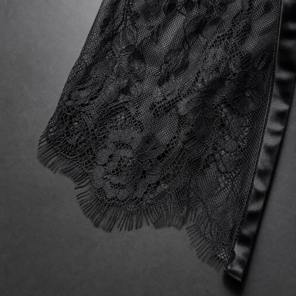 Professional fashion material macro, 1:1. Isolate one source-visible detail of the exact black flora